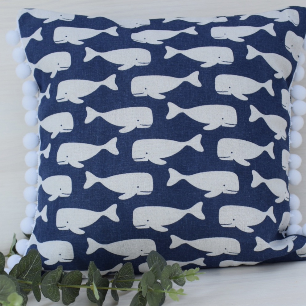 navy pom pom pillow